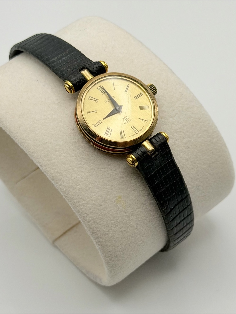 Gucci Gold-Tone Round Watch with Black Leather Strap